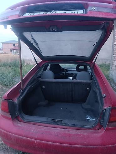 Продажа авто: Mazda Cronos: 1992 г., 2 л, Механика, Бензин, Хэтчбэк — 6