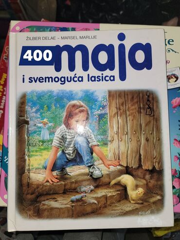 Igračke: Drvena podloga sa metalnim žicama različitih boja, na kojima su — 12