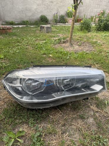 Передние фары: Передняя левая фара BMW