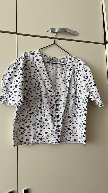Ziyafət donları: - Məhsul: Oversize T‑shirt - Brend/Qrafika: “NEW ERA” mövzulu çap; ön — 15
