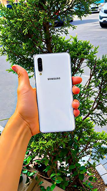 телефон fly f: Samsung Galaxy A50, 64 ГБ, цвет - Белый, Две SIM карты — 1
