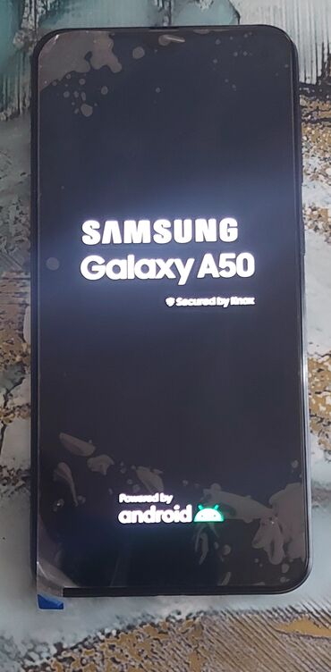 телефон fly iq4415 quad era style 3: Samsung Galaxy A50, 64 ГБ, цвет - Черный, Сенсорный, Отпечаток пальца, Две SIM карты