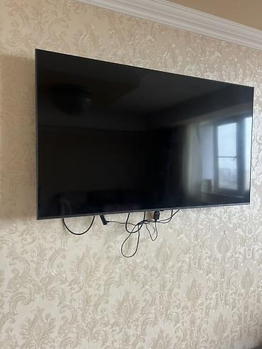 Divara quraşdırılmış televizor - Təxmini ekran ölçüsü: 50–55 düym