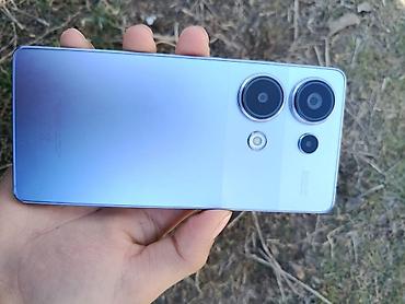 Другие мобильные телефоны: Смартфон с большим безрамочным дисплеем с отверстием под фронтальную — 6