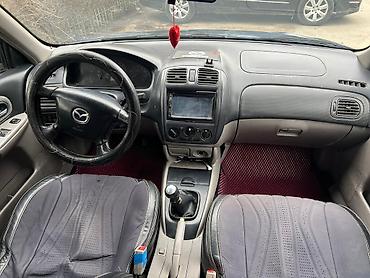 Mazda: Mazda 323: 2002 г., 1.6 л, Механика, Бензин, Хэтчбэк — 14