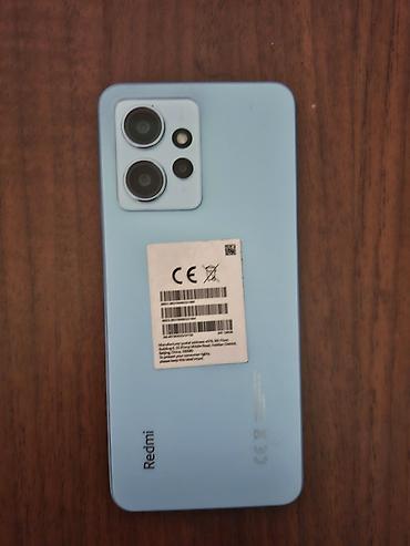 Мобильные телефоны и аксессуары: Redmi 12, 128 ГБ, цвет - Голубой, Отпечаток пальца, Face ID — 3