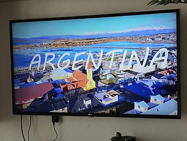 телевизоры: Телевизор LG, диагональ примерно 43–50". Тонкие рамки, настенное — 2