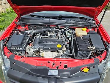 Opel: Opel Astra H hatchback – parlaq qırmızı rəngdə, 5 qapı. Texniki — 3