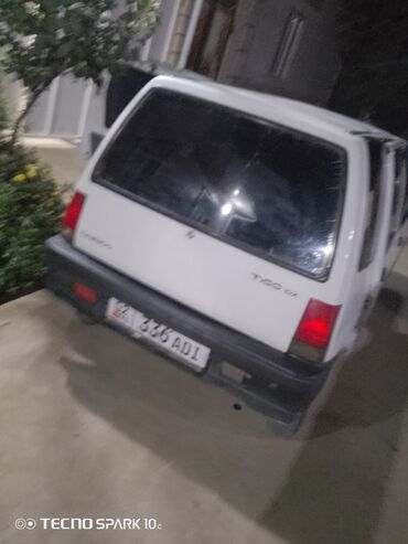 кузов тентованный: Белый городской хэтчбек Daewoo Tico SX с задним приводом. Автомобиль