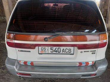 Другие автомобили: Просторный минивэн белого цвета с рейлингами на крыше — 10