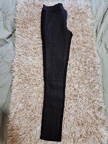 Pantalone: Ženske crne uske pantalone Dolce Gabbana sa kožnim efektom. - — 2