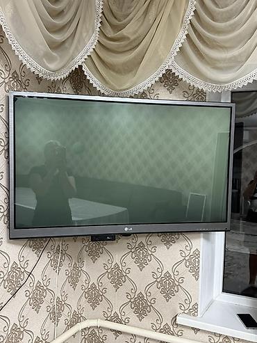 lg 24: Телевизор LG, диагональ около 40–42". Плоская панель с тонкой рамкой — 2