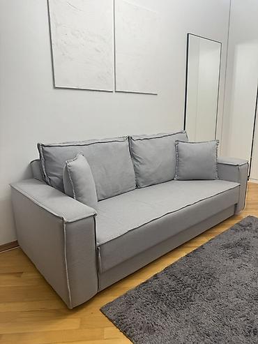 Boz rəngli divan Divanın uzunluğu 2 m, bazalıdır. Real alıcıya
