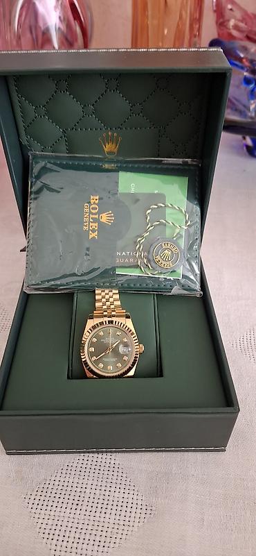 swatch saati: Rolex tərzində kişi qol saatı – qızılı korpus və Jubilee tipli metal — 1