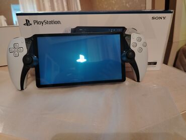 irsad playstation 3: Sony PlayStation Portal uzaqdan oyunçu. Ağ rəngdədir və PlayStation