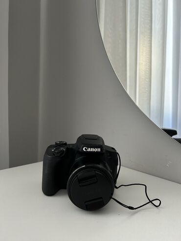canon powershot sx20 is: Canon PowerShot SX70 HS rəqəmsal kamerası qara rəngdədir. Bu kamera