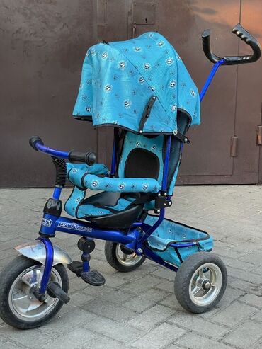 детский трёх колёсный велосипед: Коляска, цвет - Голубой, Б/у
