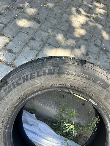 185 65 14 type 0: Michelin markalı avtomobil şini. Ölçüsü: **185/70 R14** Yük/sürət — 3