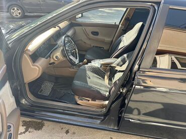 Iran Khodro: İran Khodro Samand (sedan), qara rəng. Xüsusiyyətlər: - Kuzov: 4 — 7