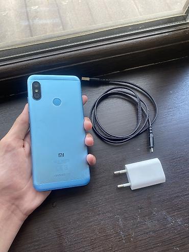 телефон fly q: Xiaomi Mi A2 Lite, 32 ГБ, цвет - Голубой, 
 Отпечаток пальца, Две SIM карты — 1