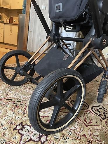 ам ням: Прогулочная коляска Cybex (линейка Priam 4— фирменная эмблема и бренд — 6