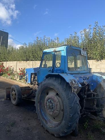 мтз 892 1: Трактор с навесным оборудованием Описание: - Колёсный трактор синего — 4