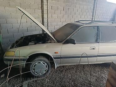 бак бенза: Mazda 323: 1990 г., 2 л, Механика, Бензин, Универсал — 1