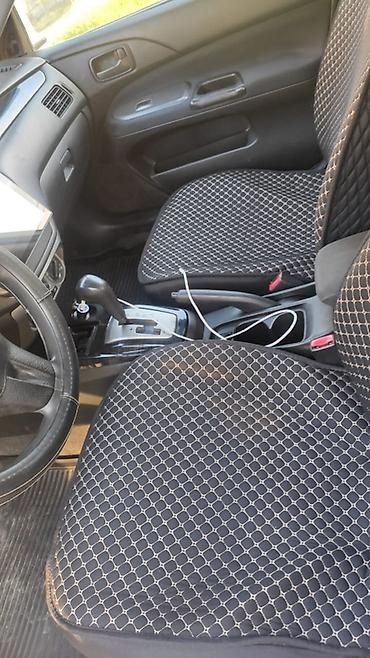 рул: Mitsubishi Lancer: 2006 г., 1.6 л, Автомат, Бензин, Седан — 7