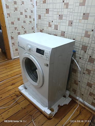 dikiş maşınları: Electrolux CompactCare paltaryuyan maşın. Öndən yükləməli modeldir — 5