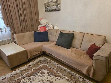 Künc divan – yumşaq bej rəngli, L formalı model. - Material: toxuması