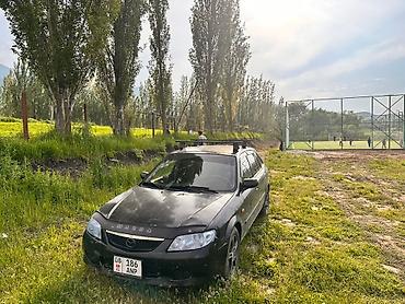 мазда фемили: Mazda 323: 2002 г., 1.6 л, Механика, Бензин, Хэтчбэк — 1