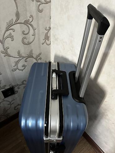 trolly bag: Чемодан на колёсах, цвет стальной синий. Особенности: - Прочный — 8