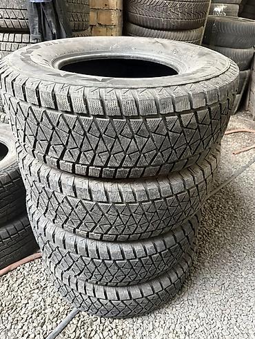 шины 26570 r16: Зимние шины Bridgestone Blizzak DM‑V2 - Размер: 265/70 R16 - Индекс — 2