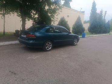 a8 d2: Mazda 626: 1997 г., 2 л, Механика, Бензин, Седан — 4
