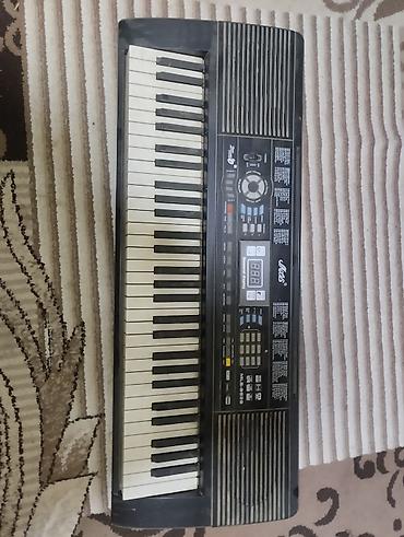 codera 2026 pdf: Elektron sintezator – Alesis ML-6059 (üzərində “Ales” loqosu görünür) — 1