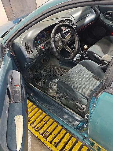 Унаа сатуу: Mazda 323: 1996 г., 1.5 л, Кол менен иштөөчү, Бензин, Хетчбек — 9