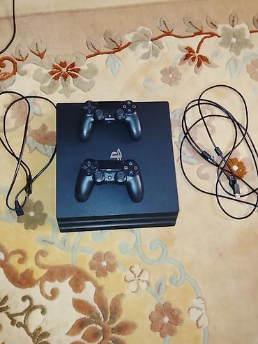playstation 4 pro oyunları: PlayStation 4 Pro (şəkildəki model) oyun konsolu Komplekt: - PS4 Pro — 1