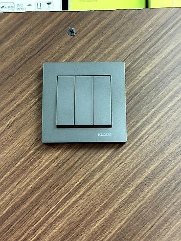Выключатели: Настенные выключатели KLAUS, графитовый матовый цвет. Описание: - — 1