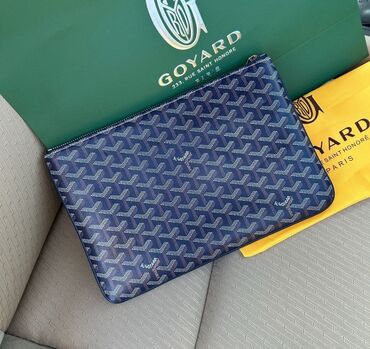 очки со сменными линзами: Клатч Goyard с фирменным геометрическим узором. Изготовлен из плотного