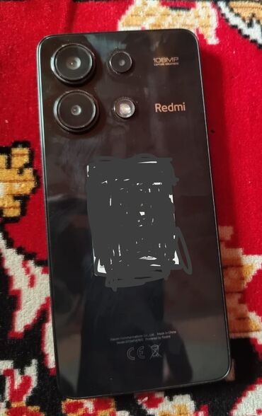 прокат плейстейшен 4: Bu, arxa tərəfində "Redmi" loqosu və "108MP" kamerası olan qara rəngli