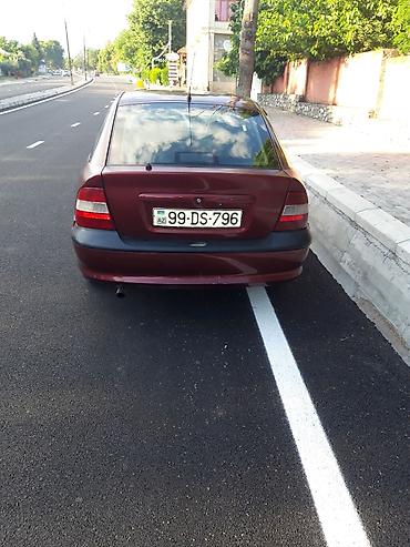 opel ehtiyat hisələri: Opel Vectra sedan – vişnə rəngi, 4 qapı, qara disklər, tonlu şüşələr — 4