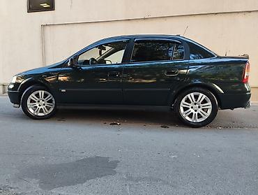 bmw e 38: Opel Astra: 1.6 l | 1999 il 400 km Sedan — 6