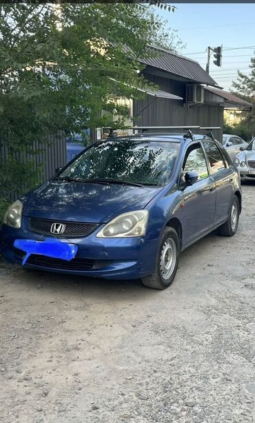 купить передние тормозные диски: Синий хэтчбек Honda Civic, оснащенный багажником на крыше. Автомобиль