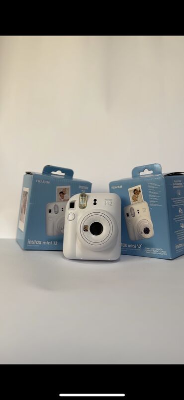 фотоаппарат моментальной печати fujifilm instax mini 8: Instax 12 mini доступен в голубой расцветке а так же в в белой