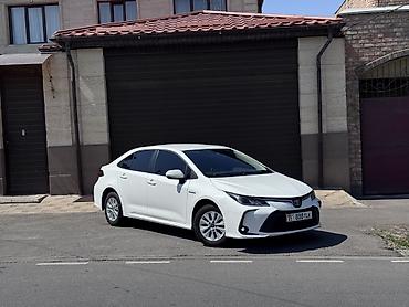 byd e1: Toyota Corolla: 2021 г., 1.8 л, Вариатор, Гибрид, Седан — 1