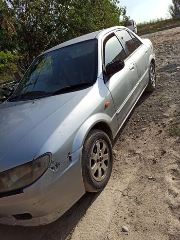 тормозной диск камри: Mazda Familia: 2001 г., 1.5 л, Автомат, Бензин, Седан