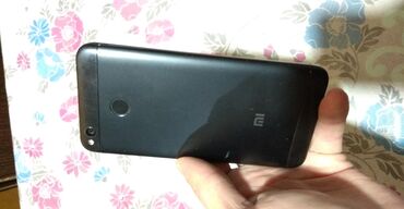 Xiaomi: Xiaomi Redmi 4X, 16 ГБ, цвет - Черный, 
 Сенсорный, Отпечаток пальца, Две SIM карты