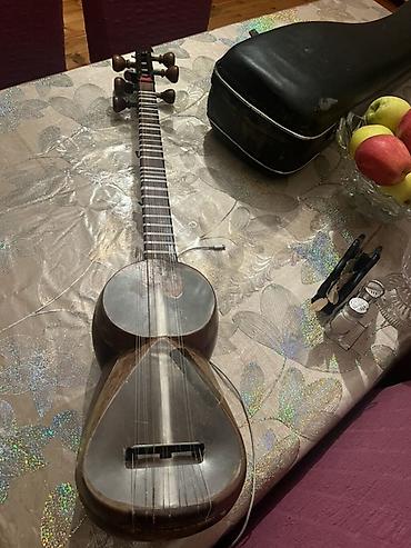 gitara satilir: Tar – milli simli musiqi aləti, sərt futlyarla Xüsusiyyətlər: - — 9