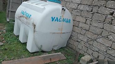 yağmur: Yağmur markalı plastik su çəni - Həcm: 3000 litr (çənin üzərində qeyd — 3