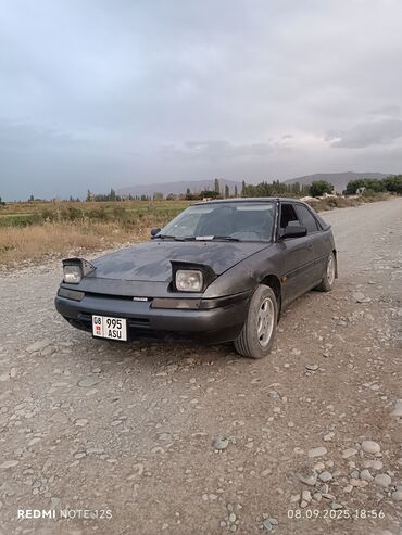 Mazda: Mazda 323: 1991 г., 1.6 л, Механика, Бензин, Хэтчбэк — 15